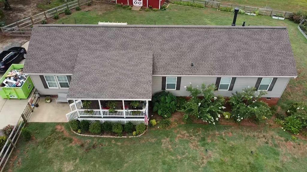 Ariel photo of home with new HDZ Barkwood roofing Shingles